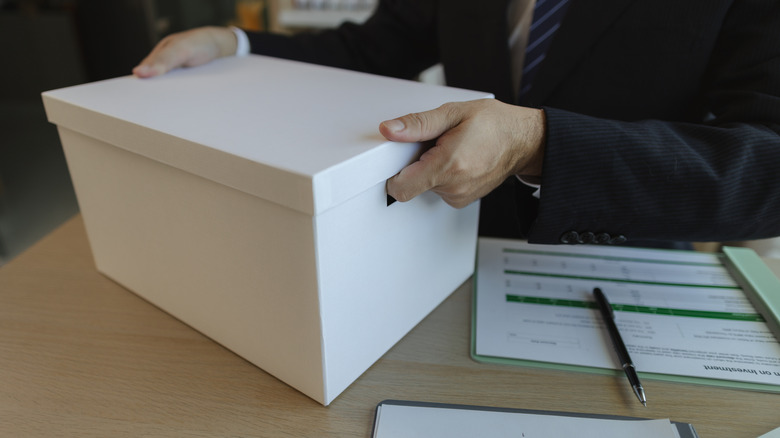 Person holding document storage box