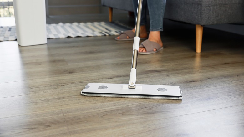 Woman mopping her floors