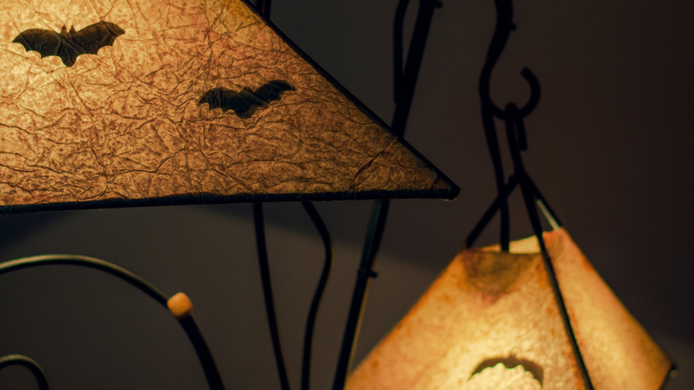 bat cutouts forming silhouette on lamp shade