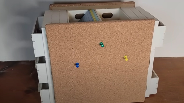 A DIY project that used Dollar Tree crates as a base with several sides covered by cork board
