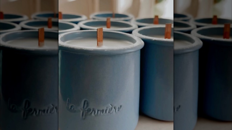 Blue yogurt pots turned into candles with wood wicks