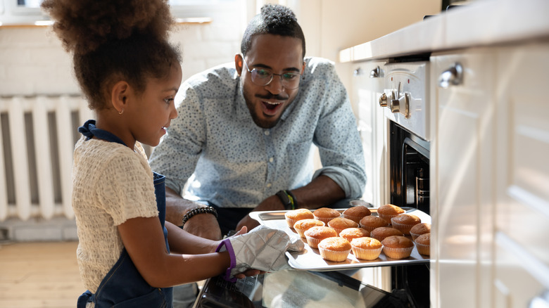 Family baking muffins