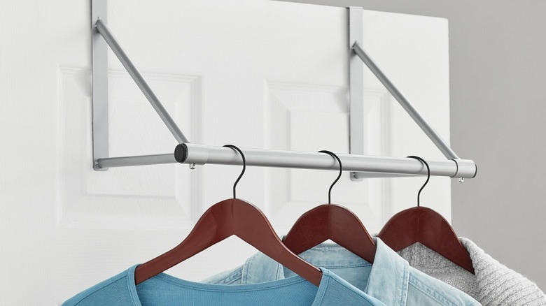 clothes hanging from over-the-door rod