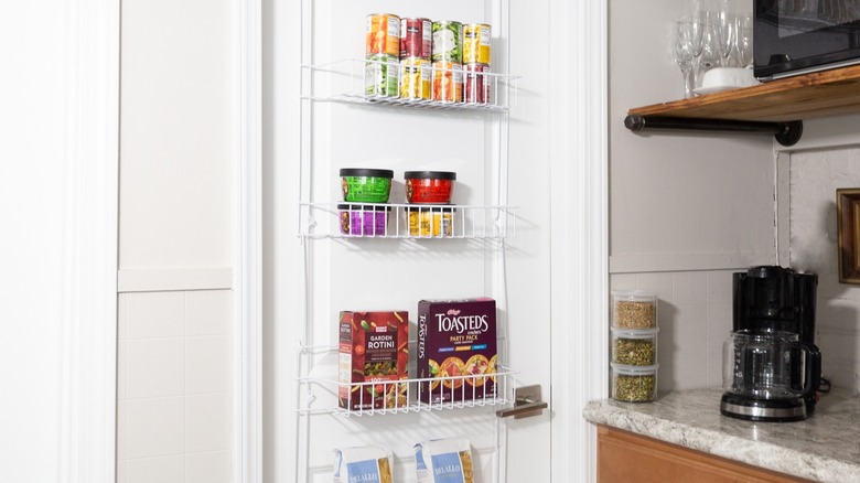 containers of food neatly organized on a wire over-the-door shelf