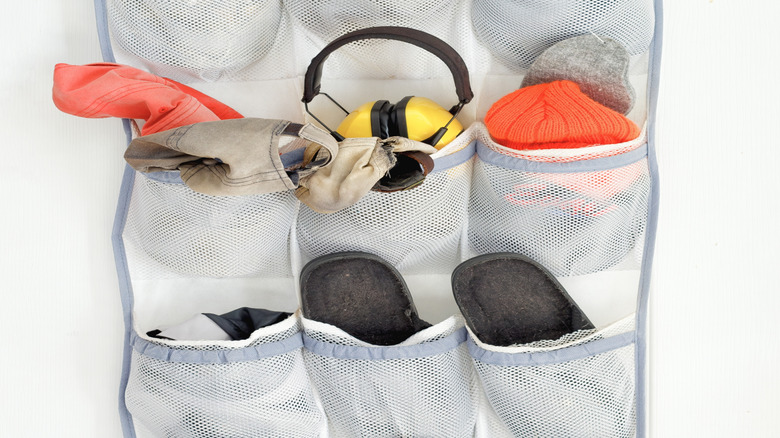 shoe organizer housing hats, socks, and ear protection