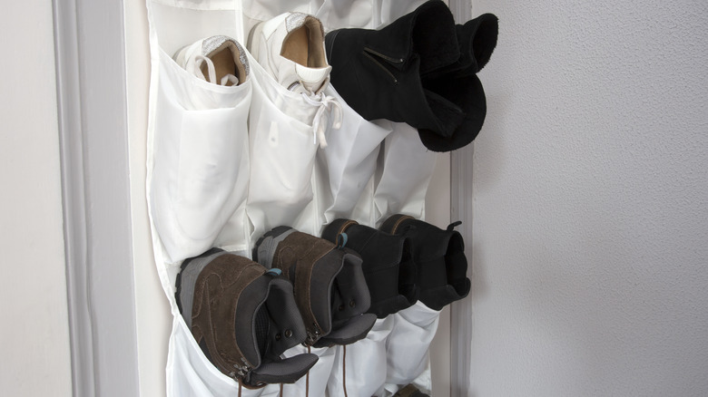 shoes in the pockets of over-the-door shoe organizer