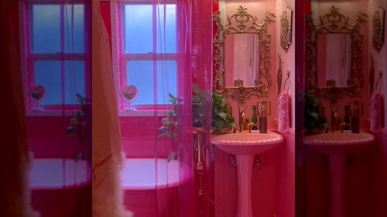 hot pink bathroom with pink tub and sink