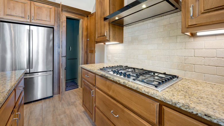 kitchen with honey oak wood cabinets