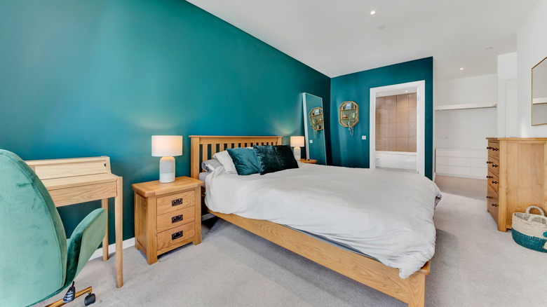 Teal accent wall in a bedroom