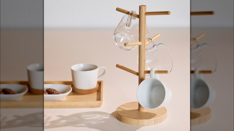 Bamboo mug tree with white ceramic and glass mugs