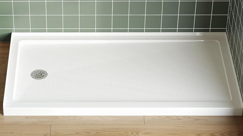 A closeup of a white ABS shower pan