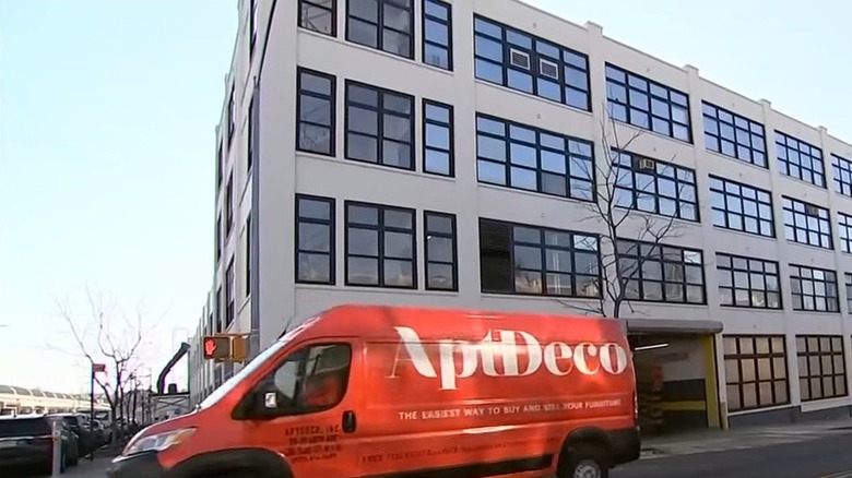 Red AptDeco van outside a modern loft in New York City