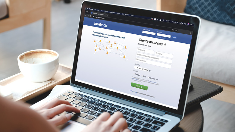Person logging into Facebook