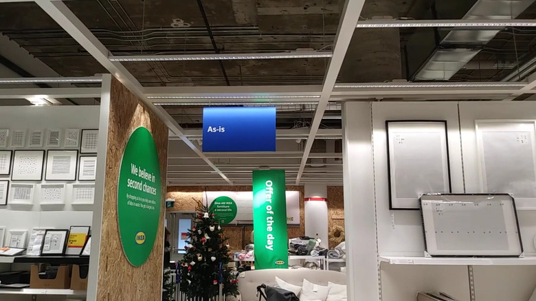View of IKEA As-Is section as seen from the art and frame section of the store