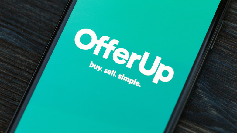 Closeup shot of OfferUp landing page on a mobile phone