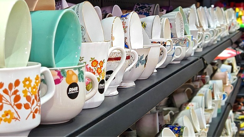 Shelves of a thrift store with Pyrex pieces