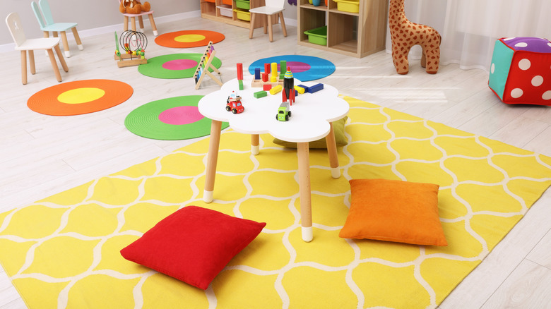 bright yellow area rug in playroom