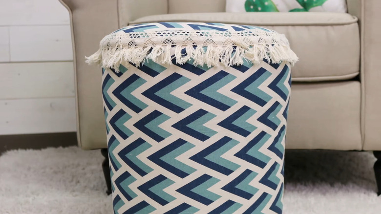 An ottoman crafted out of a bucket