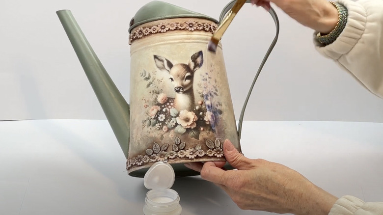 A watering can turned into a vase.