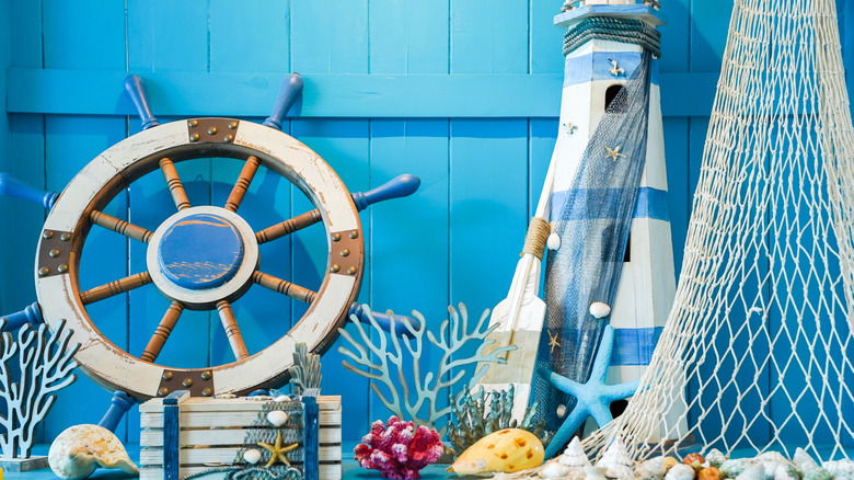 A bright blue panel wall with maritime decor