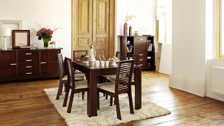 Dark wood furniture in a bright room