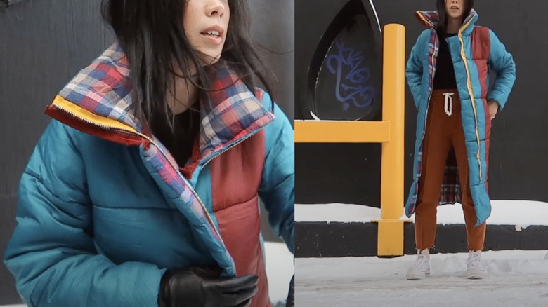 A woman showing how to make a puffer jacket from a sleeping bag