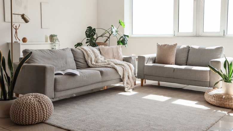 A small living room with gray sofas.
