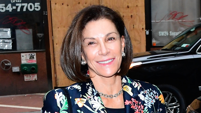 Hilary Farr smiling in a floral blazer.