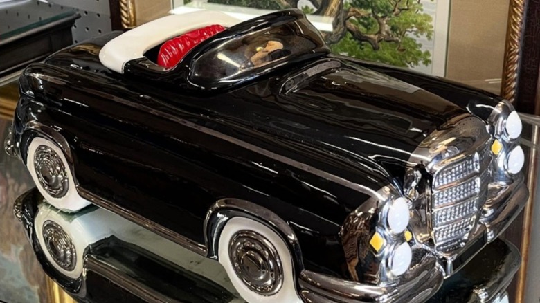 Black convertible cookie jar on shelf