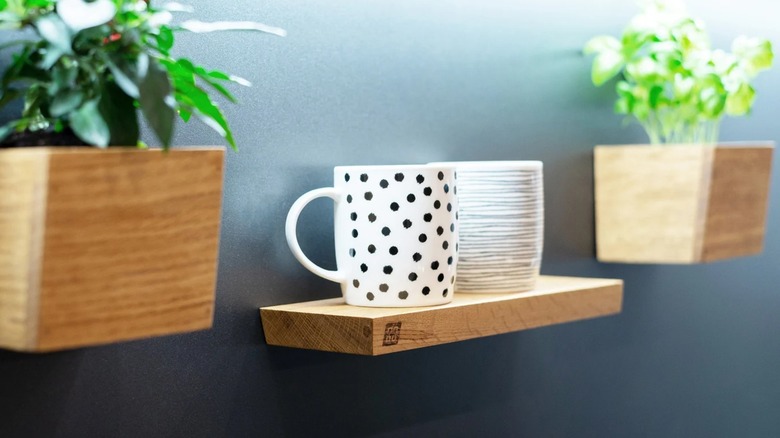 Floating wooden magnetic shelf on side of fridge