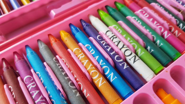 Colored crayons on a tray