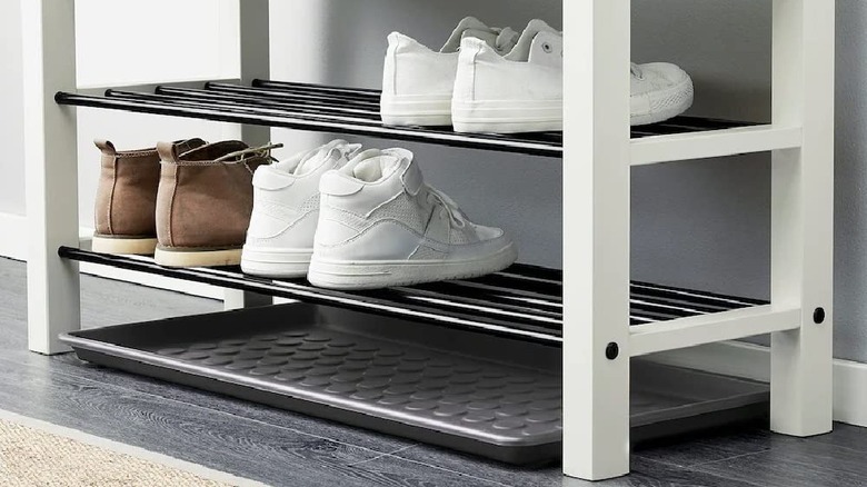 A BAGGMUCK Shoe Tray under a shoe rack