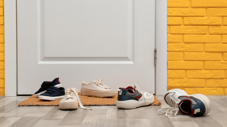 A mess of shoes on the floor