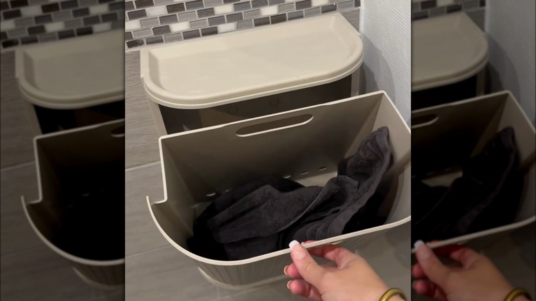 Person using IKEA bin as a laundry hamper