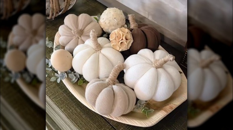 tray of homemade pumpkins from old socks