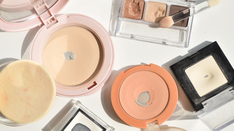 A variety of used cosmetics and powders