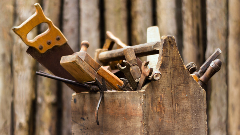 Wood box of used hand tools
