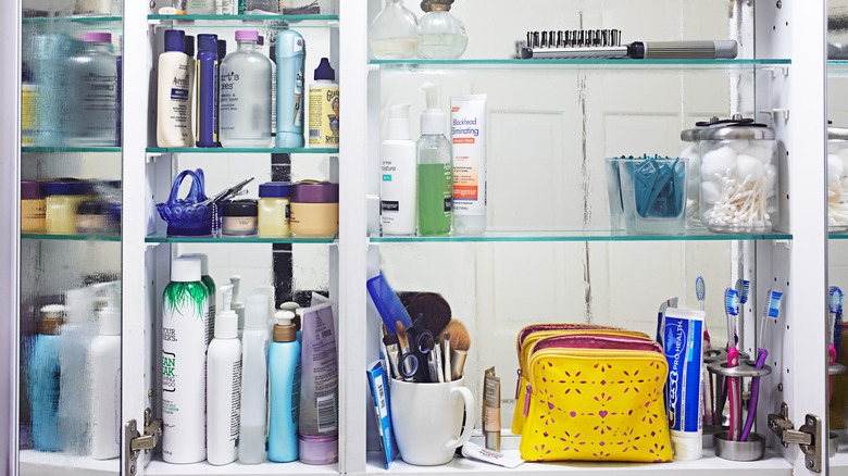 Cluttered bathroom medicine cabinet