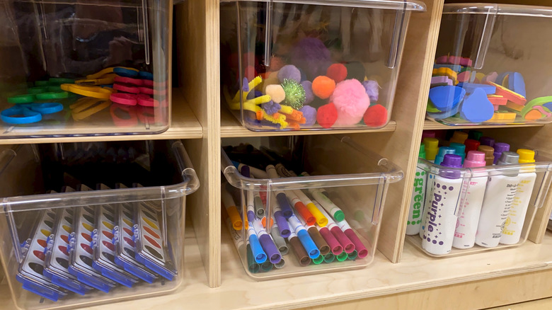 Clear bins of craft supplies