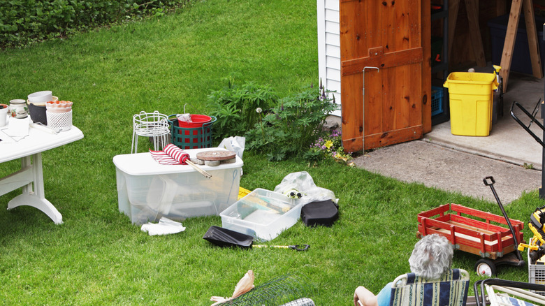 Person taking a break from organizing their shed