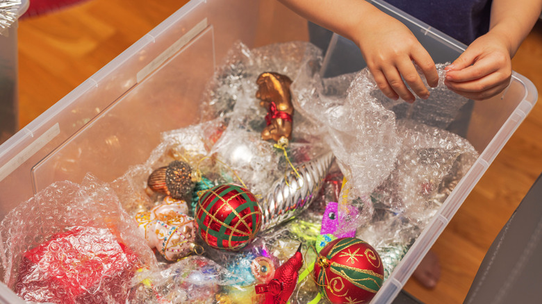 Christmas ornaments in clear storage bin