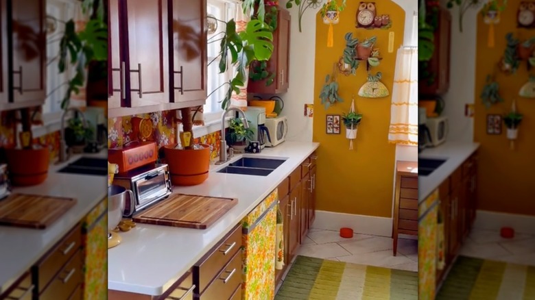 Screenshot of a video of a 70s inspired yellow and brown kitchen