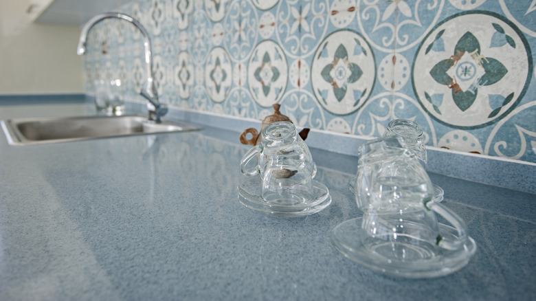 A kitchen with blue speckled countertops