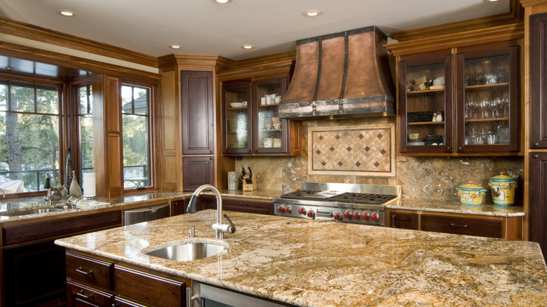 Brown granite countertops in a 2000s Tuscan style kitchen