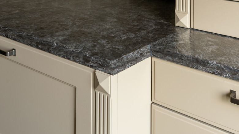 A side view of a gray granite countertop