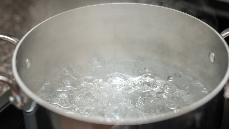 A close-up of a pot of boiling water