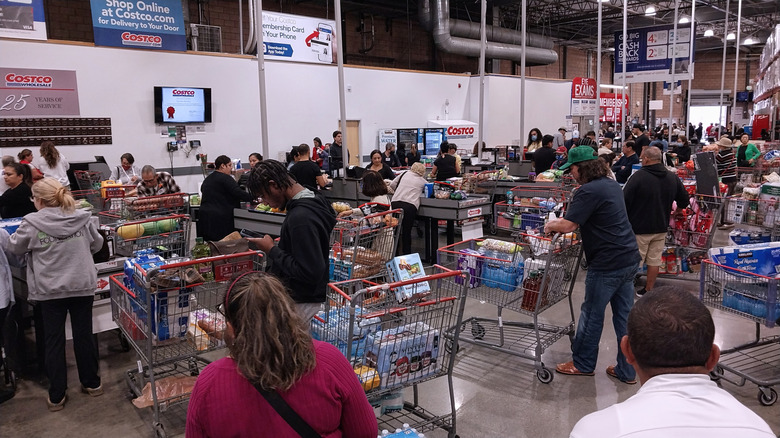 Customers waiting in line to check out at Costco