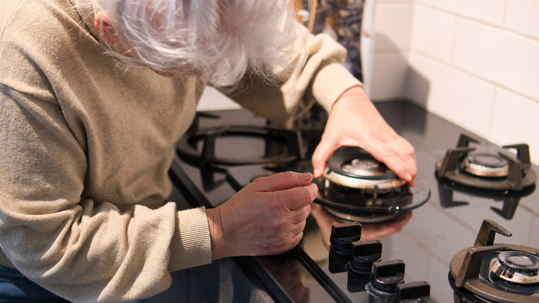 Person having difficulty with the stove