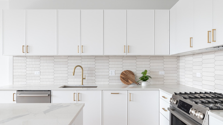 all white kitchen cabinets in a kitchen