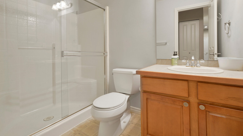 Orange maple cabinetry in a bathroom